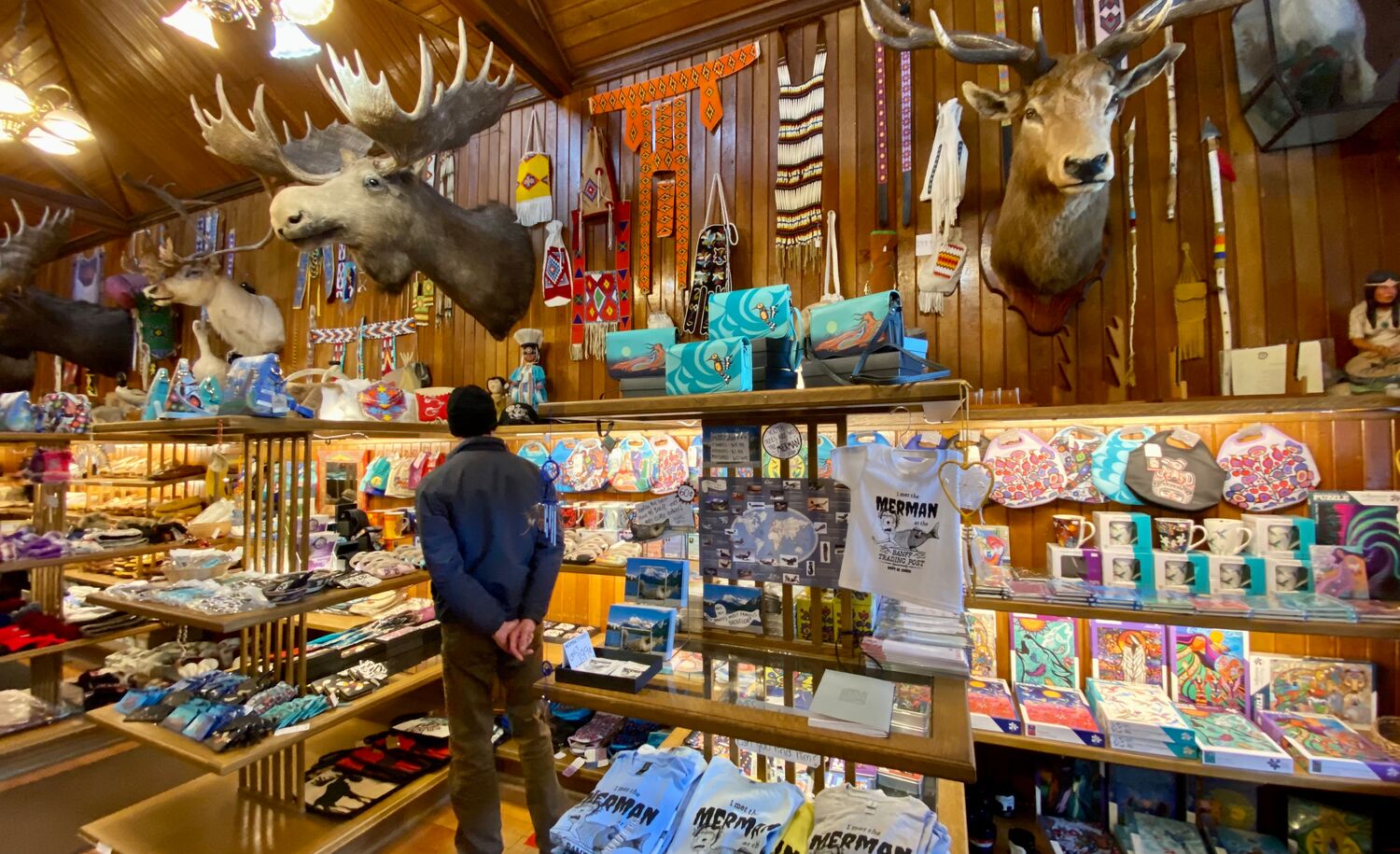 A person looks at the things inside the Banff Trading Post